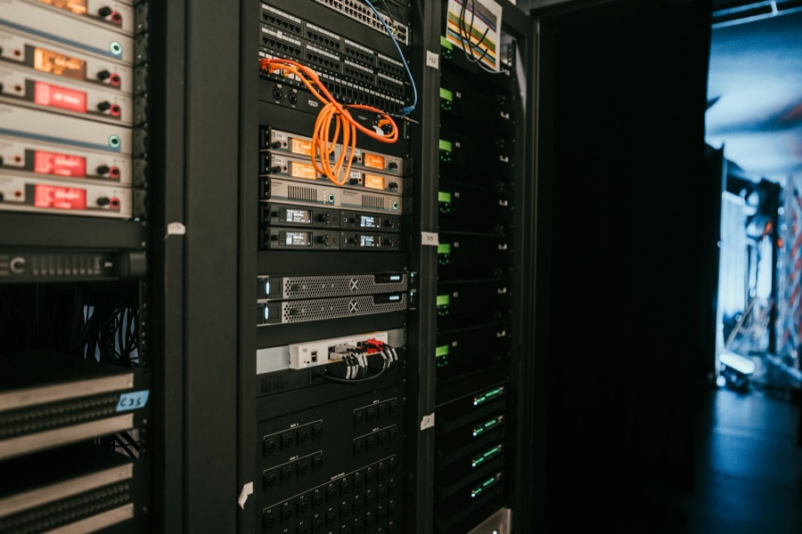 Server racks with orange fibre patch cables