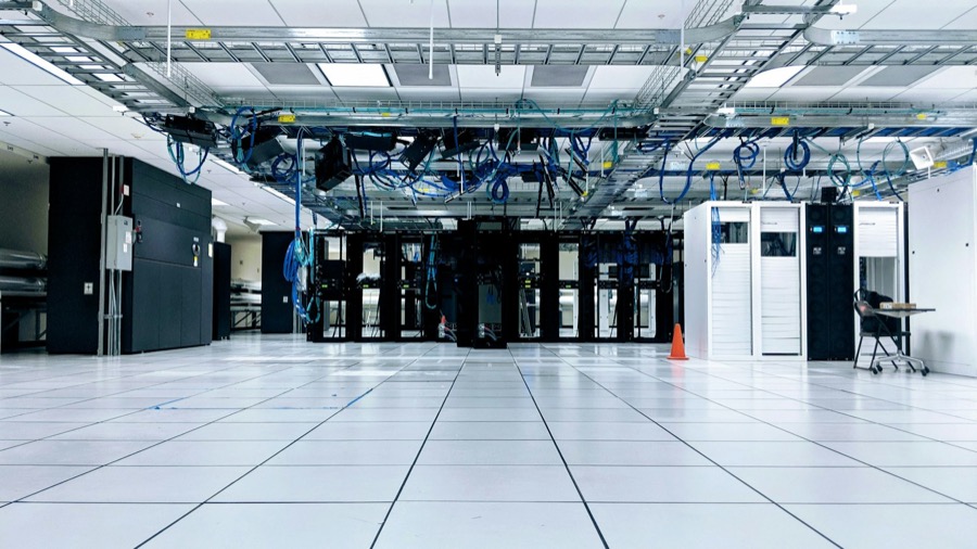 Data centre hall with network cabinets and overhead cable trays