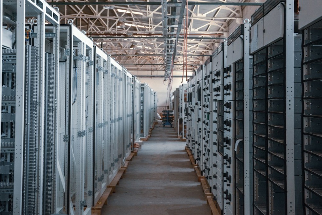 Data centre aisle lined with equipment racks
